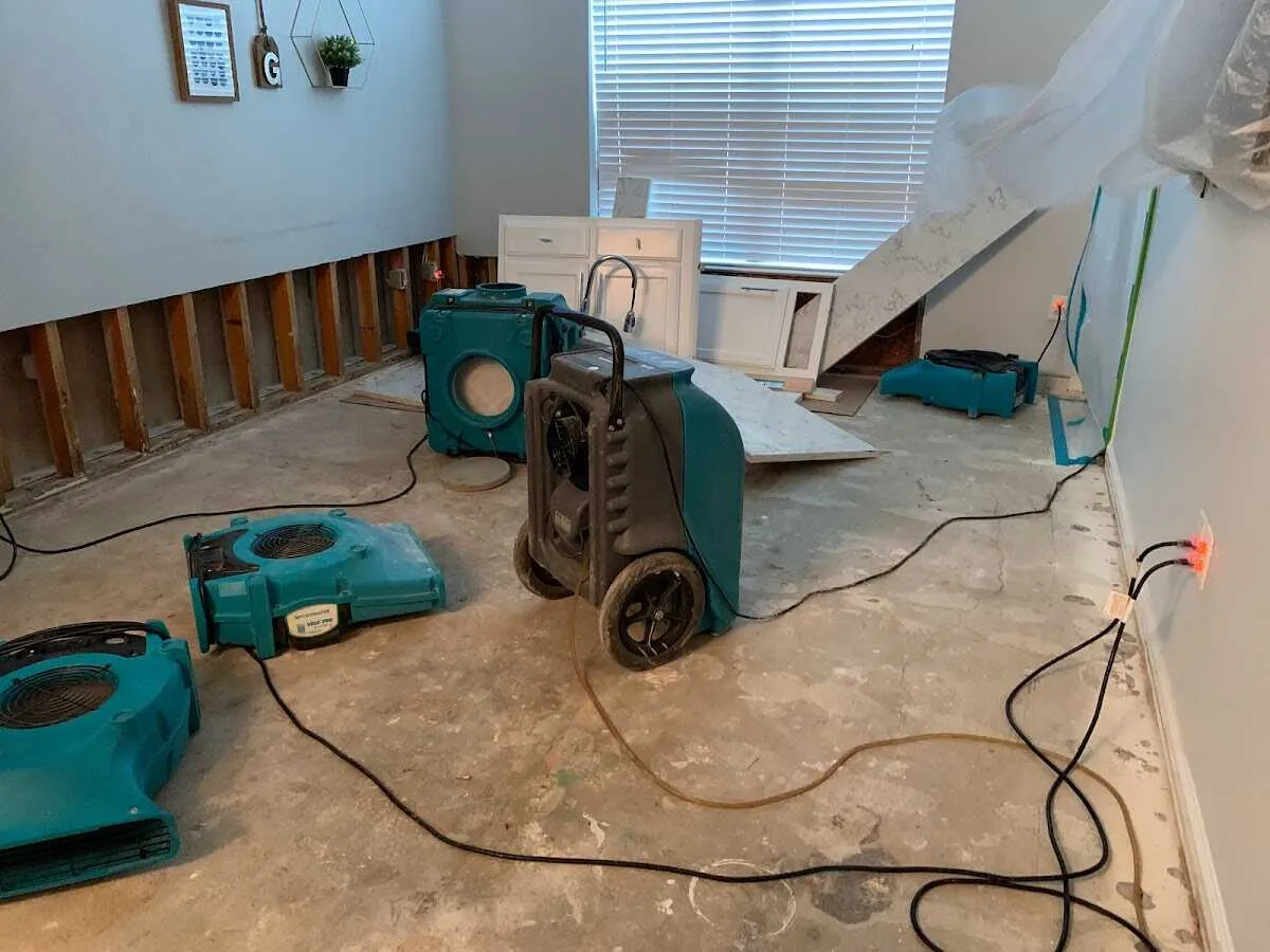 Dehumidifier in flood-cut room for Water Damage Restoration in Maplewood